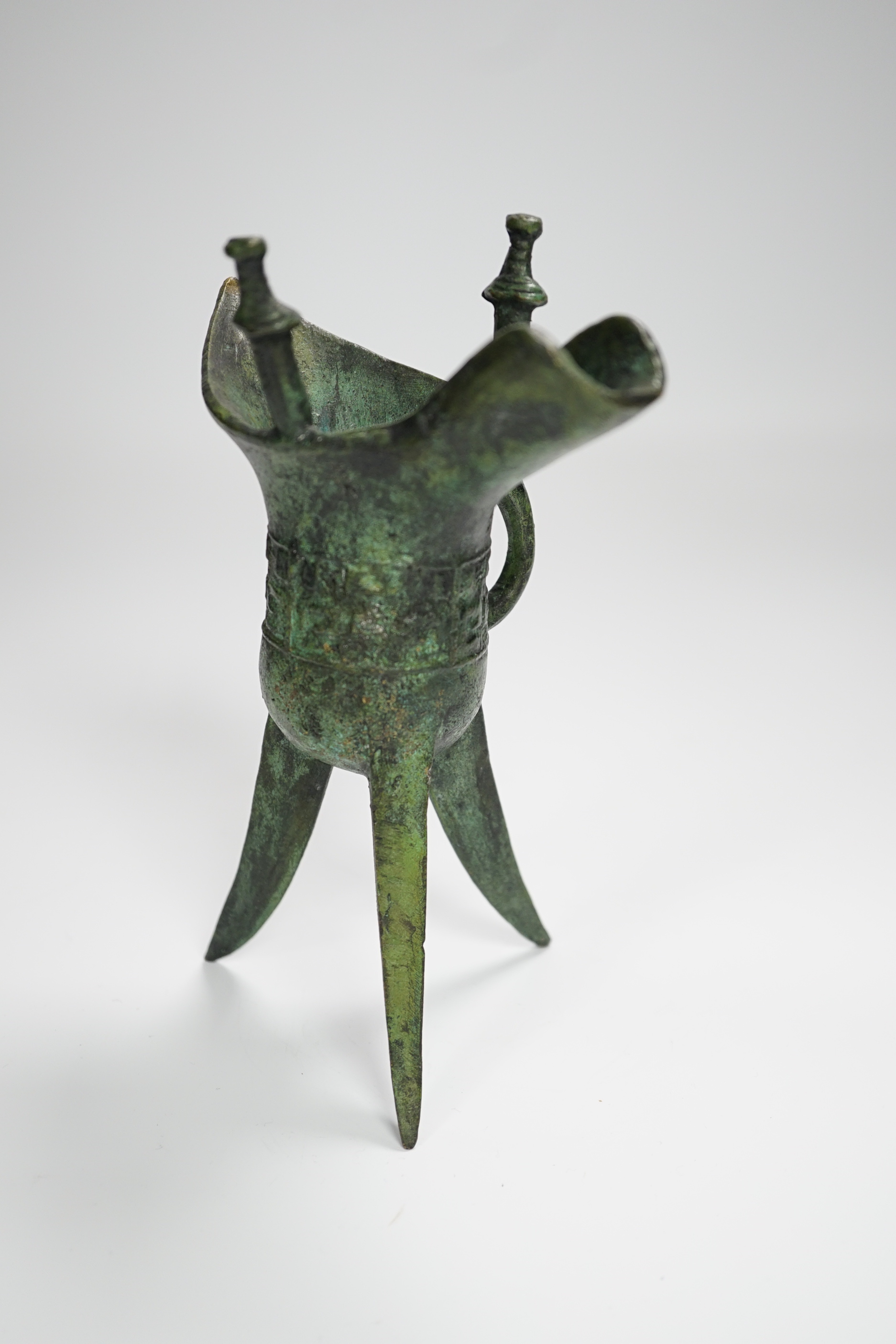 A Chinese bronze archaistic tripod Jue cup (ex. late prof. R.M. Hicks OBE), 18cm